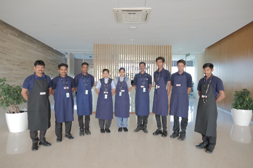 Professional Urja Facility team demonstrating the benefits of amc over on-call cleaning at an industrial site in Indore.